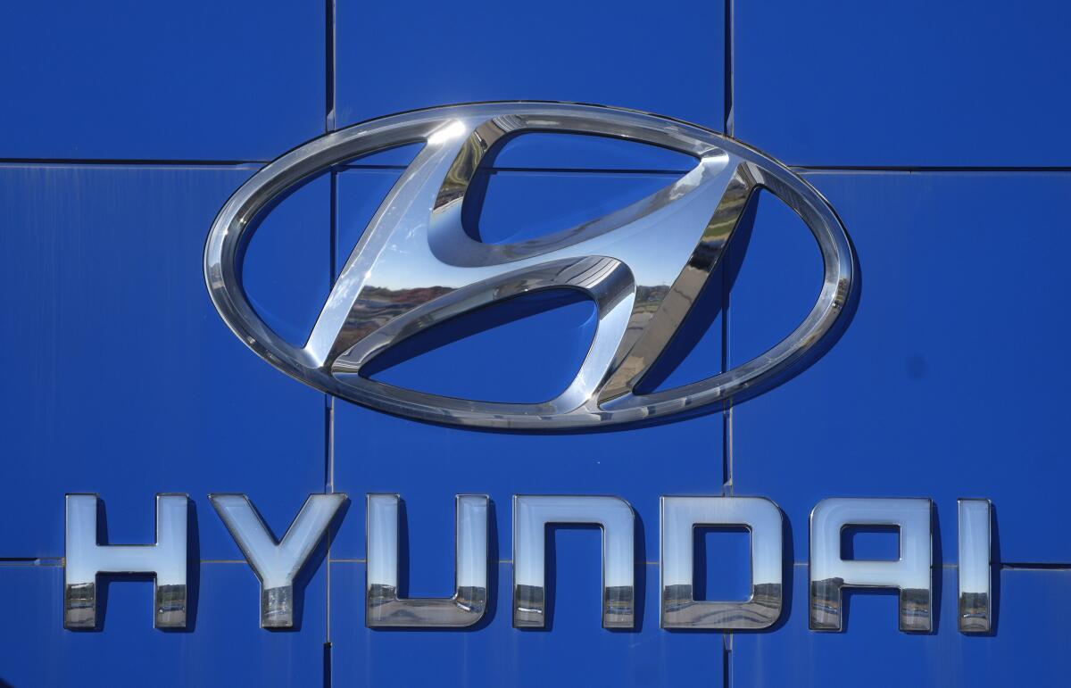 The company logo adorns a tower at a Hyundai dealership Monday, Oct. 17, 2022, in Loveland, Colo. Hyundai is telling the owners of more than 44,000 SUVs in the U.S., Tuesday, Nov. 1, to park them outdoors because they can catch fire even if the engines are off. The automaker says certain 2018 Santa Fe Sport models should be parked away from other vehicles and structures until they are repaired as part of a recall. (AP Photo/David Zalubowski)