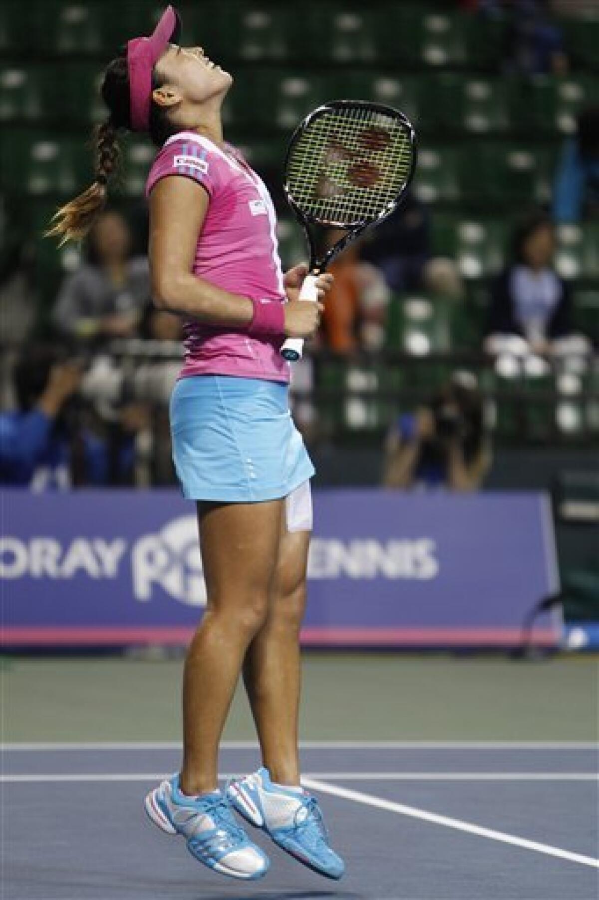 Ayumi Morita of Japan reacts after losing a point against Marion Bartoli of France during their second round match of during the Japan Pan Pacific Open tennis tournament in Tokyo, Monday, Sept. 26, 2011. Bartoli won 6-3, 0-6, 6-3. (AP Photo/Shizuo Kambayashi)
