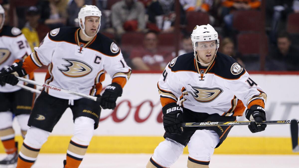 Ducks defenseman Cam Fowler, right, skates ahead of captain Ryan Getzlaf during the first period of a 2-1 win over the Arizona Coyotes on April 11.
