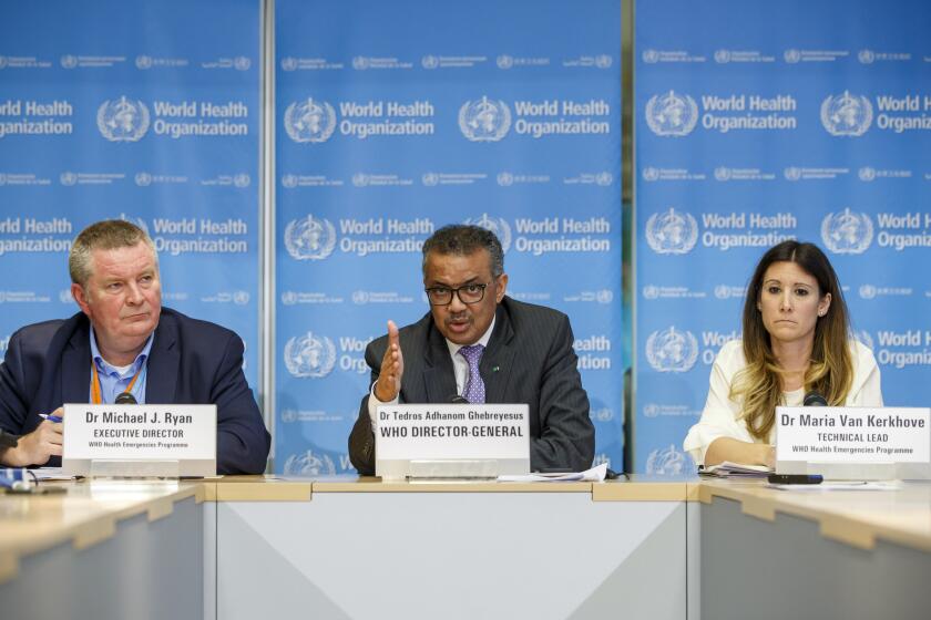 In this Monday, March 9, 2020 photo, Tedros Adhanom Ghebreyesus, director general of the World Health Organization speaks during a news conference on updates regarding on the novel coronavirus COVID-19, at the WHO headquarters in Geneva, Switzerland. Accompanying him are Michael Ryan, left, executive director of WHO's Health Emergencies program, and Maria van Kerkhove, right, technical lead of WHO's Health Emergencies program. On Wednesday, March 11, 2020, the WHO declared the new coronavirus a pandemic, suggesting the disease is spreading across the globe unchecked. (Salvatore Di Nolfi/Keystone via AP)