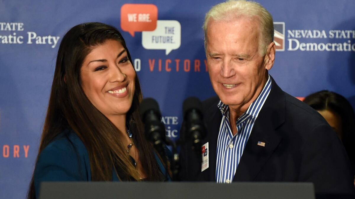 Then-Vice President Joe Biden with Lucy Flores at a Las Vegas rally on Nov. 1, 2014. Flores says some of Biden's behavior made her uncomfortable.