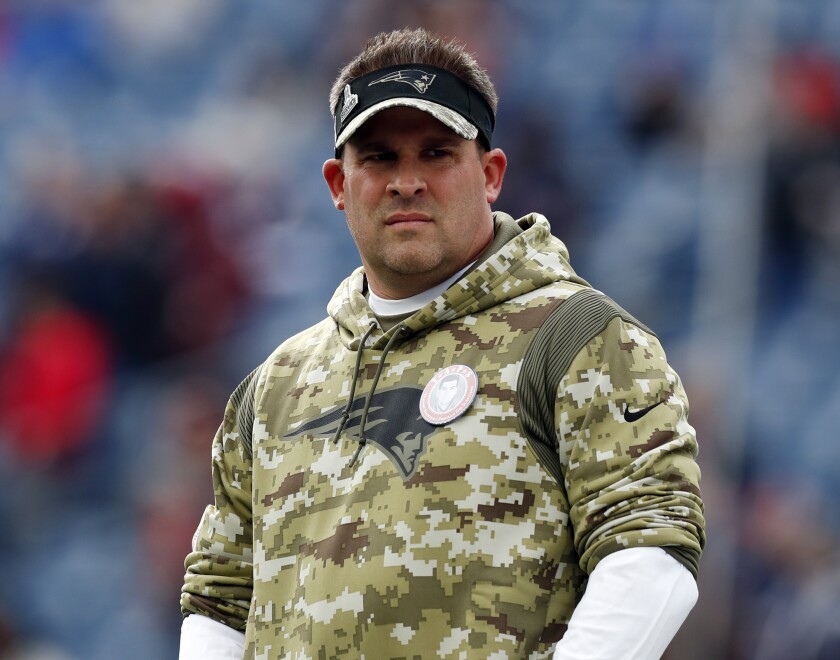 FILE - New England Patriots offensive coordinator Josh McDaniels looks on prior to an NFL football game Nov. 14, 2021, in Foxborough, Mass. The Las Vegas Raiders have made a request to interview the Patriots' McDaniels for their head coach opening. A person familiar with the search said Thursday, Jan. 27, 2022, the Raiders made the request to speak with McDaniels about filling the void left when Jon Gruden resigned in October. The person spoke on condition of anonymity because the team was not announcing its candidates. (AP Photo/Michael Dwyer, File)