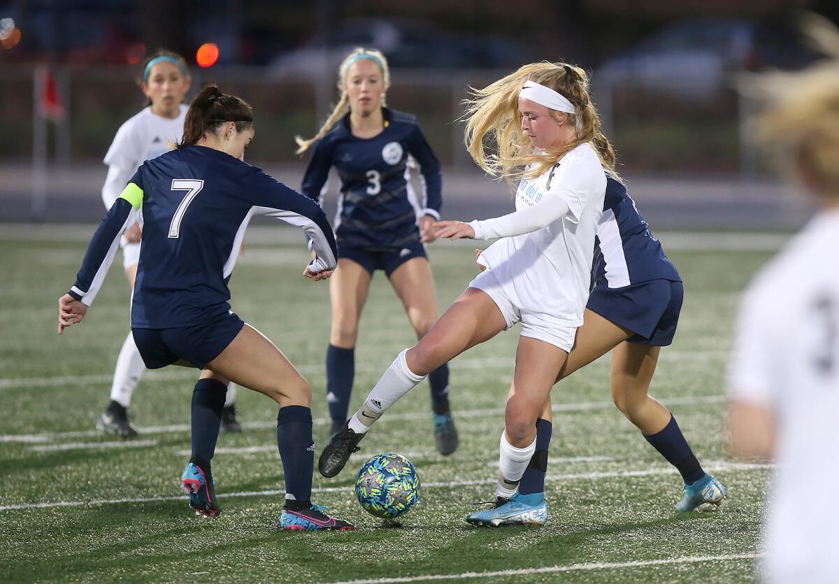 Corona del Mar's Bella Vigeland, right, steals the ball from Newport Harbor's Sadie Pitchess, left, during the Battle of the Bay match on Thursday.