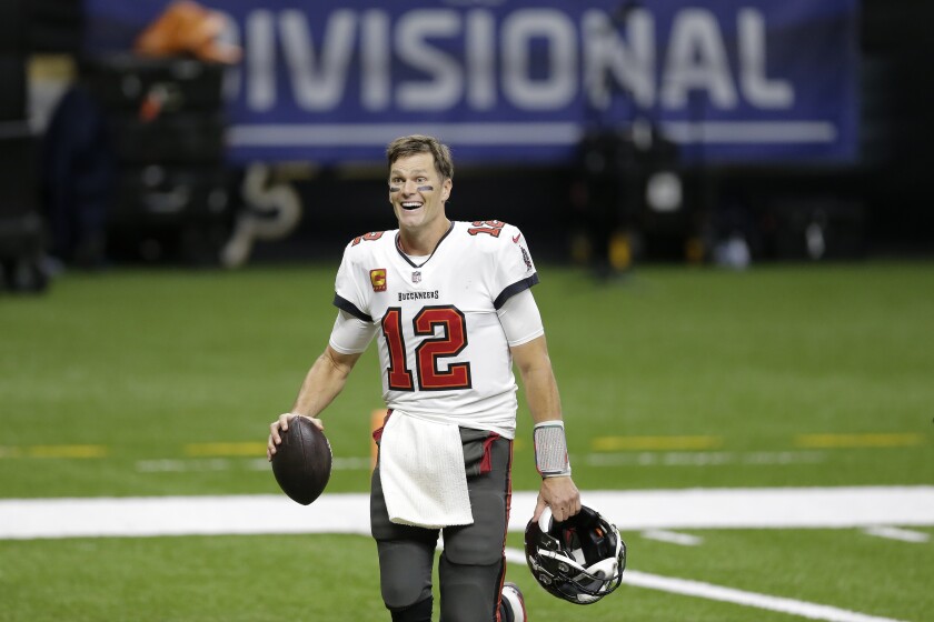 Tampa Bay Buccaneers quarterback Tom Brady leaves the field an NFL divisional round playoff football game against the New Orleans Saints, Sunday, Jan. 17, 2021, in New Orleans. The Buccaneers won 30-20. (AP Photo/Brett Duke)