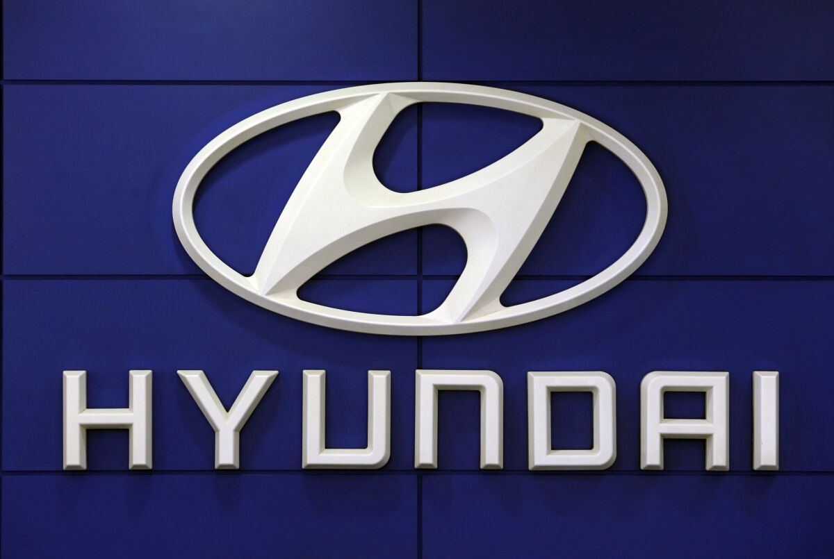 FILE - This July 26 2018 file photo shows the logo of Hyundai Motor Co. in Seoul, South Korea. Hyundai is recalling over 390,000 vehicles in the U.S. and Canada, Tuesday, May 4, 2021, for problems that can cause engine fires. In one recall, owners are being told to park outdoors until repairs are made. That recall covers more than 203,000 Santa Fe Sport SUVs from 2013 through 2015. (AP Photo/Ahn Young-joon, File)