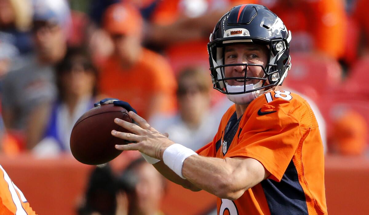 Denver Broncos quarterback Peyton Manning throws during a game against the Baltimore Ravens on Sunday.