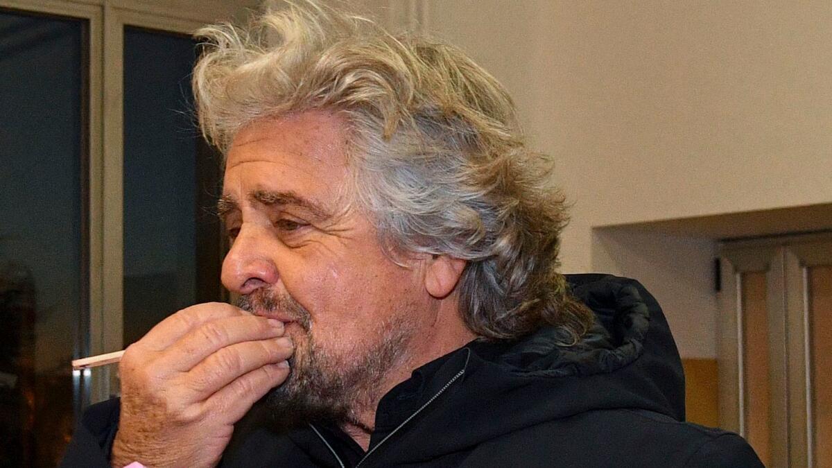 Five Star Movement leader Beppe Grillo prepares to vote at a polling station in Genoa, Italy, on Dec. 4, 2016.