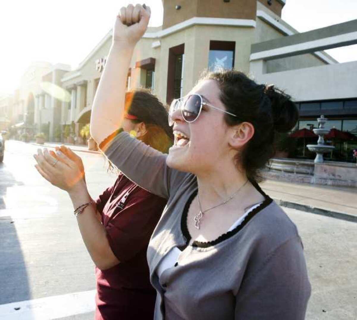 Suzanna Sargsyan, 19, chants '2, 4, 6, 8, we suppport the end of rape' as she marches along Glendale Avenue as part of a first-time event in Glendale called In Her Shoes to raise awareness to domestic violence and violence toward women.