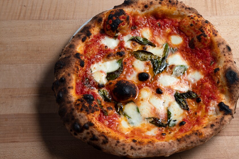 A small round wood-fired pizza.
