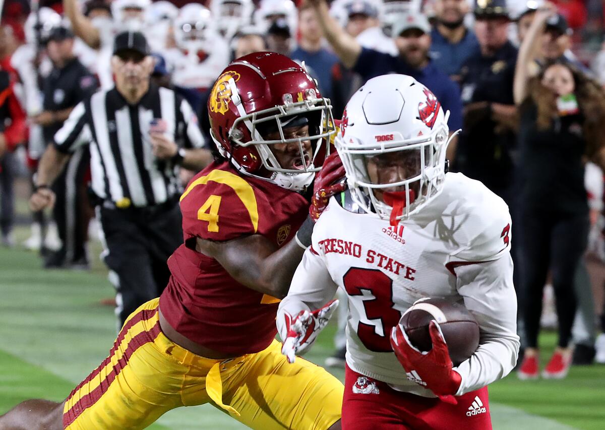 Fresno State wide receiver Erik Brooks scores a touchdown in front of USC free saftety Max Williams on Sept. 17, 2022.