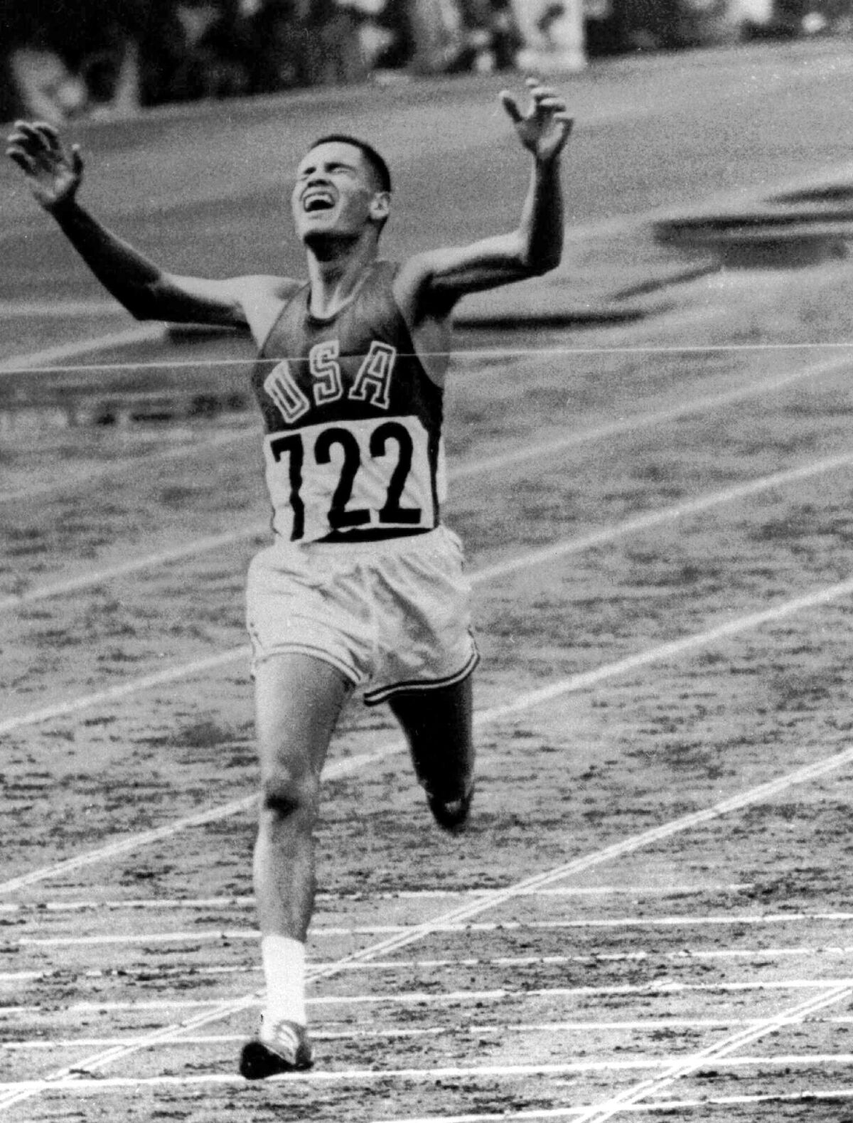 FILE - In this Oct. 14, 1964, file photo, U.S. Marine Lt. Billy Mills pulls off a stunning upset by winning the 10,000 meters Olympic race in Tokyo. Mills set an Olympic record 0f 28:24:4, and was the only American ever to win the event. (AP Photo/File)