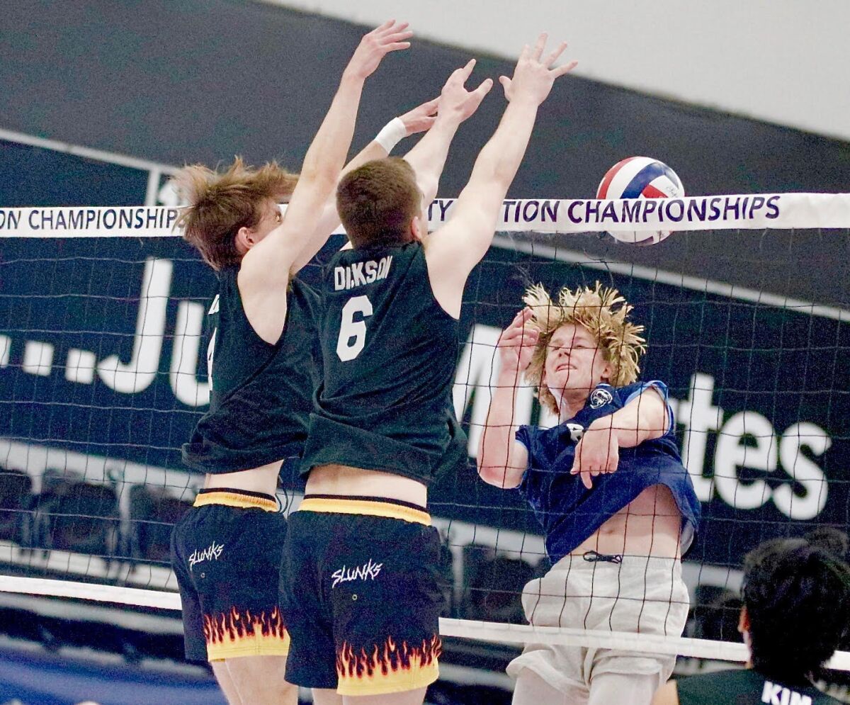 Chatsworth's Chase Dunn and Justin Dickson block a kill attempt by Palisades' Blake Pecsok.