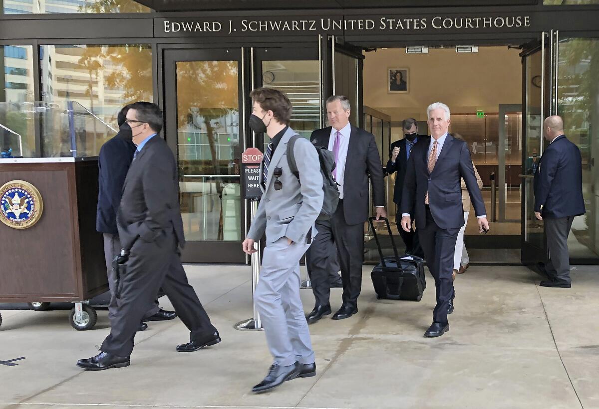 Seventh Fleet defendants and their lawyers in the "Fat Leonard" trial leave court on April 26, 2022.