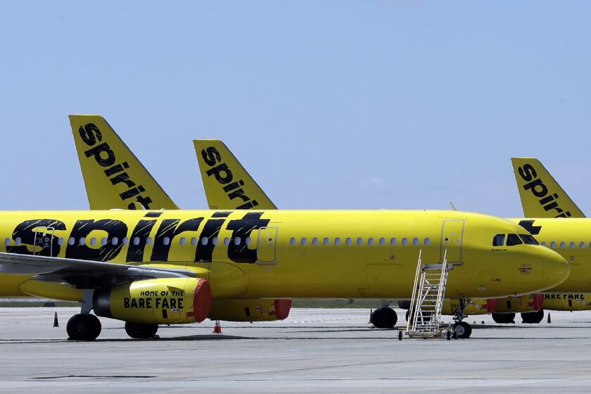 FILE - A line of Spirit Airlines jets sit on the tarmac at Orlando International Airport on May 20, 2020, in Orlando, Fla. The airline experienced significant delays on Thursday. (AP Photo/Chris O'Meara, File)