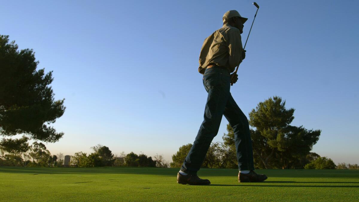 Vietnam veteran Walter Donaldson plays on the nine-hole Heroes Golf Course in Westwood in 2002. A fundraiser to repair and maintain the golf course is being held Wednesday.