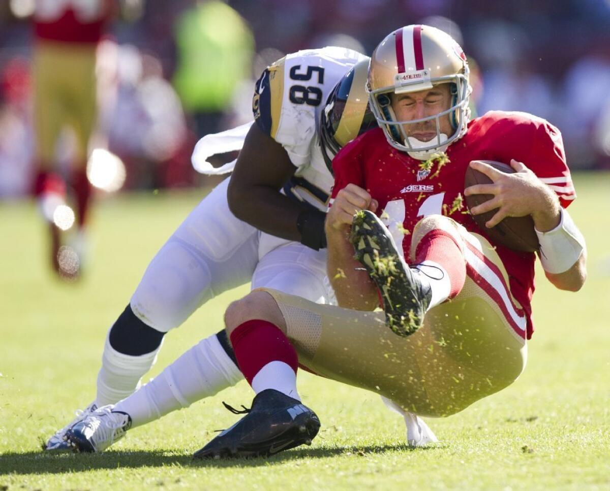 Future plaintiff? 49ers quarterback Alex Smith gets creamed during a 2012 game in San Francisco. He left with a concussion.