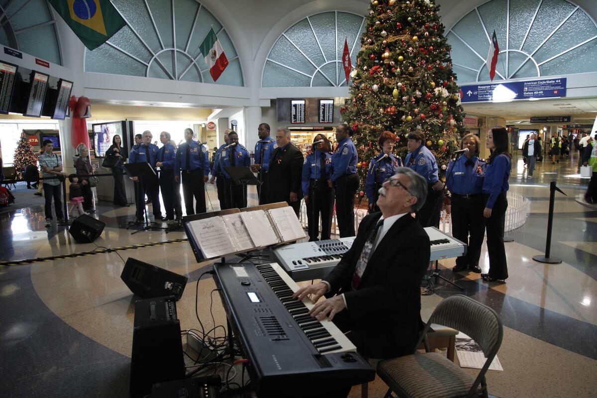 LAX goes for holiday cheer. In 2011, the TSA Chorus, shown, performed. This year, Santa Claus and stress dogs were on the scene.
