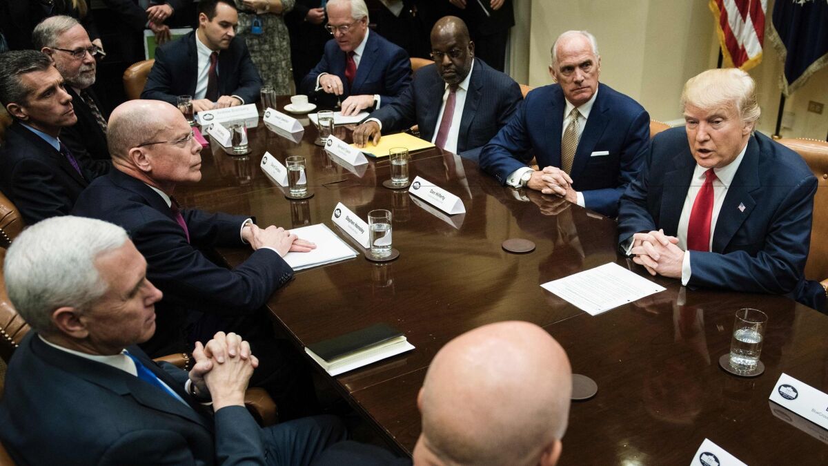 President Trump and Vice President Mike Pence with CEOs last month: Among those who would benefit from repeal of the ACA pay rule are Stephen Hemsley of UnitedHealth Group (at Pence's left), David Cordani of Cigna (to Hemsley's left) and Joe Swedish of Anthem (fourth from right).