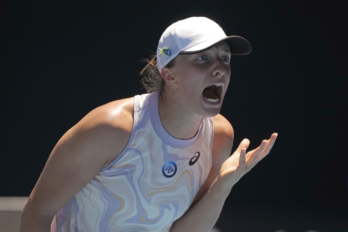 Iga Swiatek reacts during her fourth-round loss to Elena Rybakina at the Australian Open on Jan. 22, 2023. 