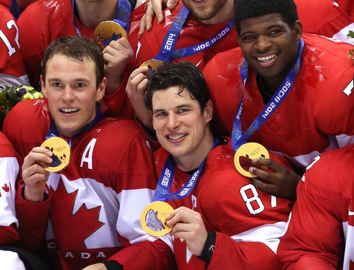 Canada players Jonathan Toews, Sidney Crosby and P.K. Subban celebrate after defeating Sweden for the gold medal.