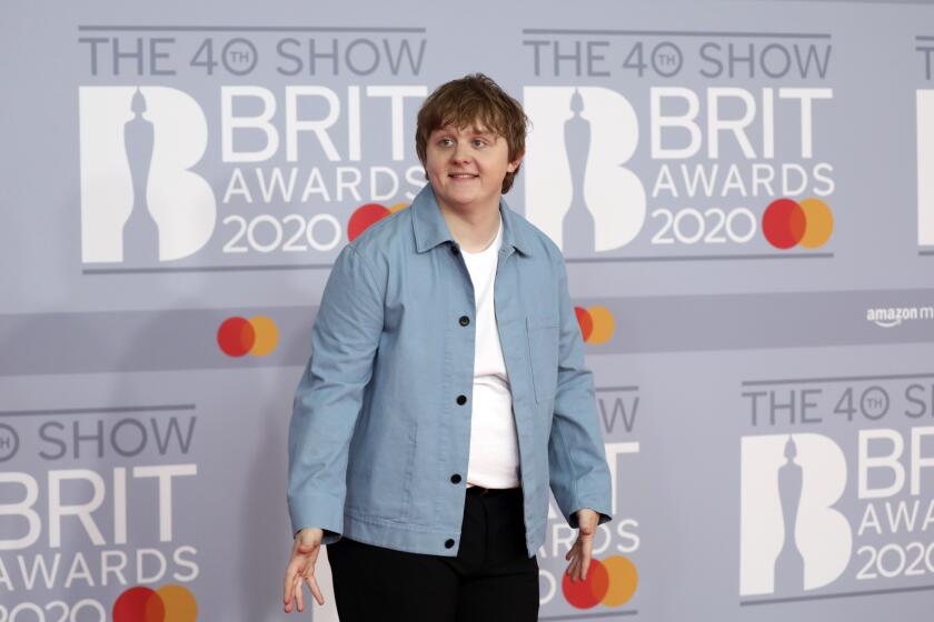 Lewis Capaldi poses for photographers upon arrival at Brit Awards 2020 in London, Tuesday, Feb. 18, 2020.(Photo by Vianney Le Caer/Invision/AP)