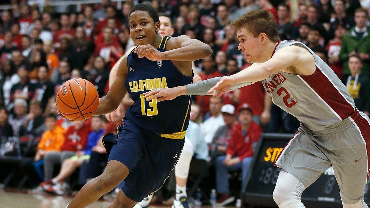 California guard Charlie Moore (13) drives against Stanford guard Robert Cartwright (2) during the second half Friday.