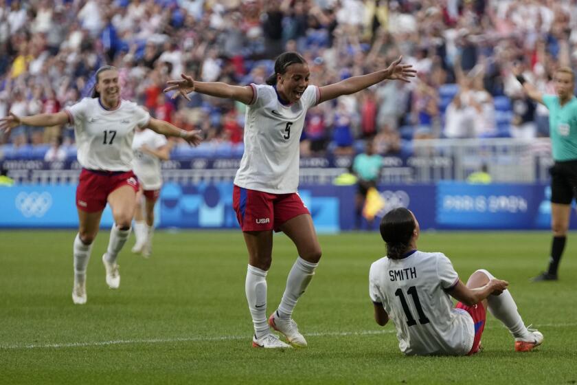 American Sophia Smith celebrates with teammates after scoring against Germany 