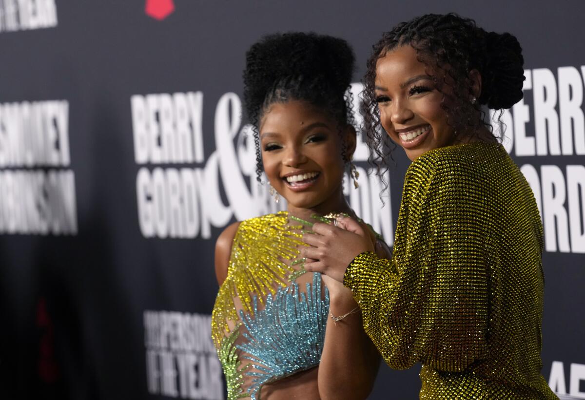 Halle Bailey, left, and Chloe Bailey, both in sparkling gowns