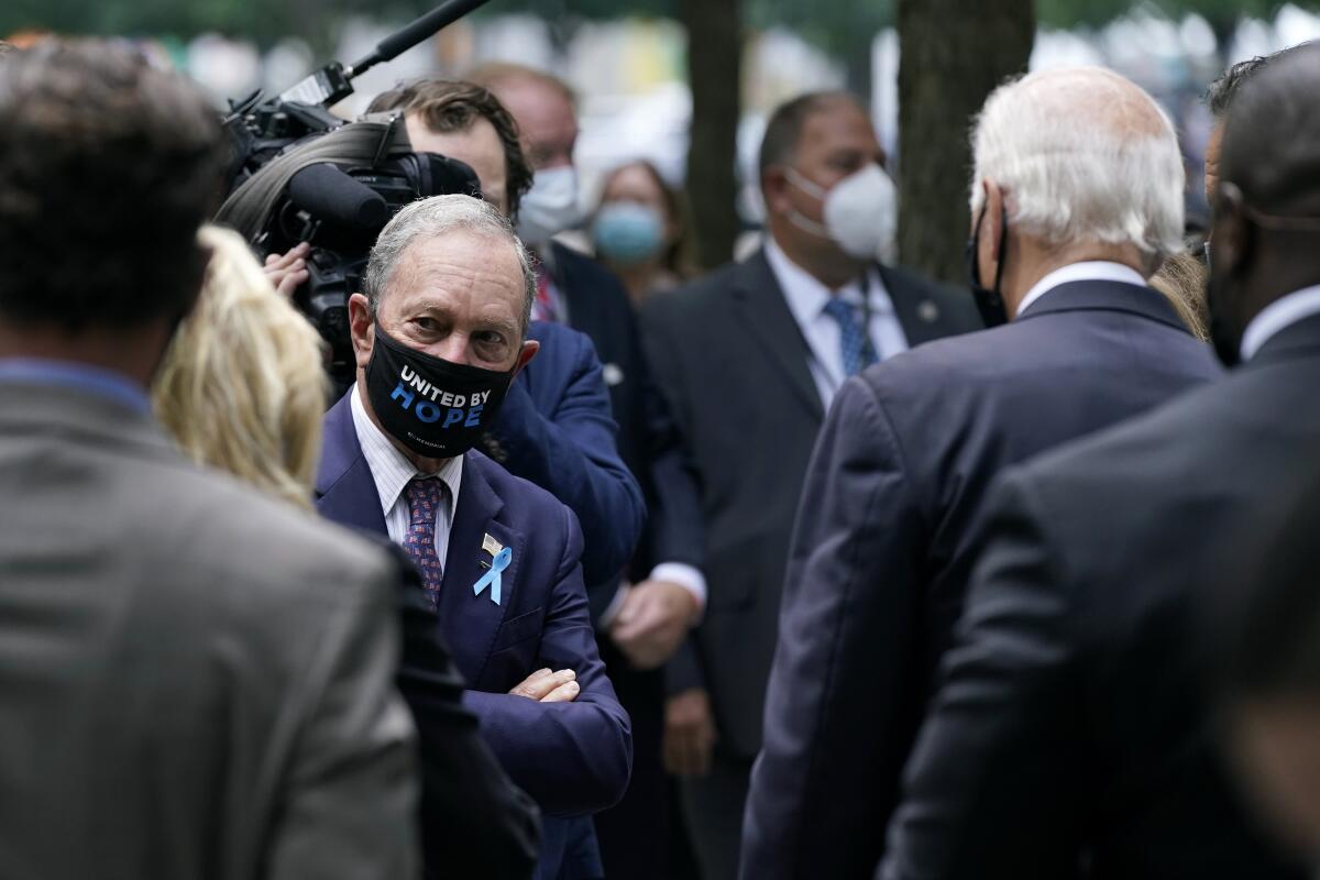 Michael Bloomberg visits with Joe Biden at the National September 11 Memorial in New York on Friday. 