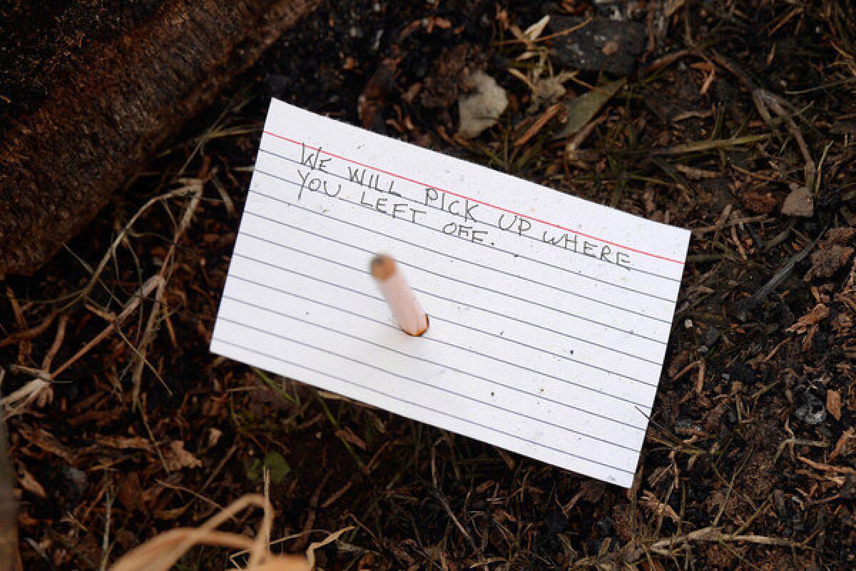 A note placed at a makeshift memorial at the Hancock Park site where journalist Michael Hastings died June 19, 2013.