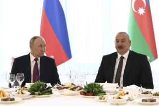 Russian President Vladimir Putin, left, and Azerbaijani President Ilham Aliyev attend a state reception at the Gulustan Palace in Baku, Azerbaijan, Monday, Aug. 19, 2024. (Mikhail Tereshchenko, Sputnik, Kremlin Pool Photo via AP)