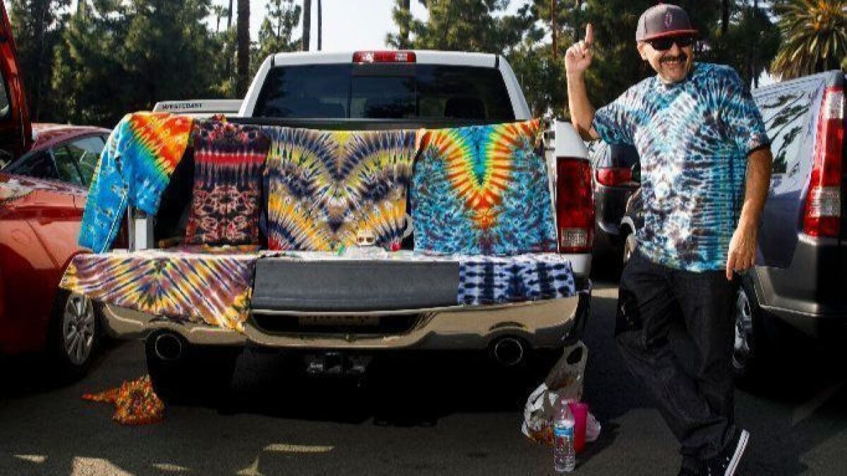 Ronnie Martinez was selling tie-dye shirts and Grateful Dead-inspired artwork from his pickup truck in a parking lot outside of the Hollywood Bowl before the Dead & Company concert in June. He was also looking for a ticket to the show itself.