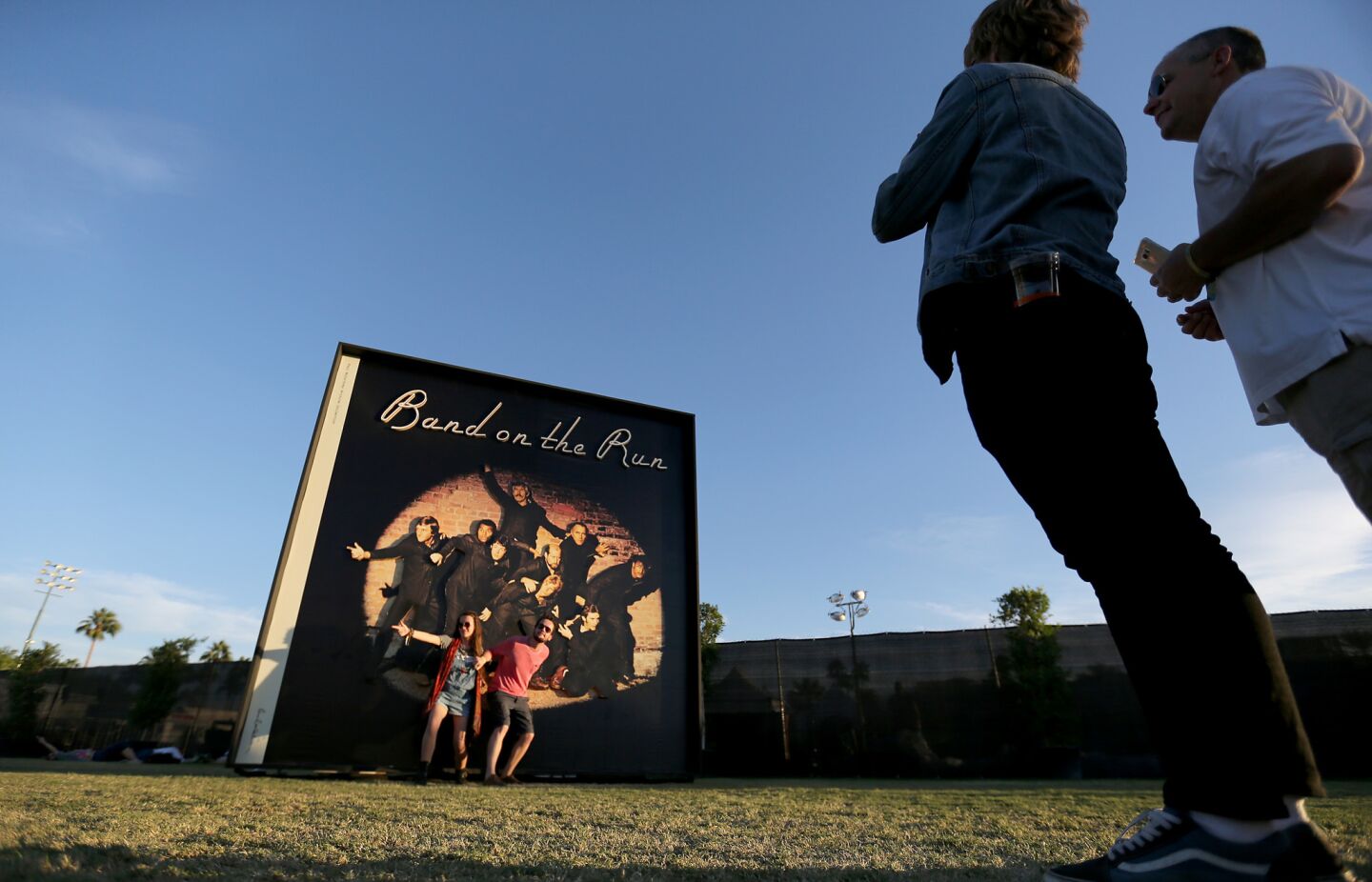 Music fans take pictures at a large reproduction of the album cover for the Wings' 1973 release of "Band On The Run."