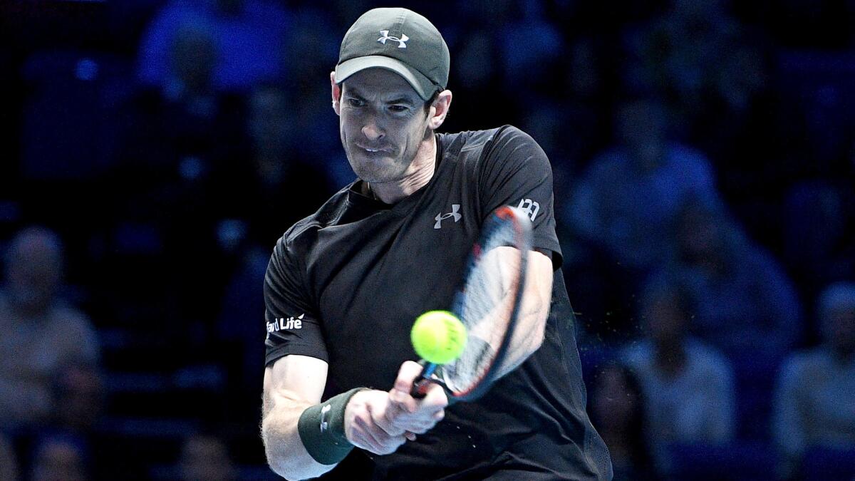 Andy Murray returns a shot against Stan Wawrinka at the ATP World Tour Finals on Friday.