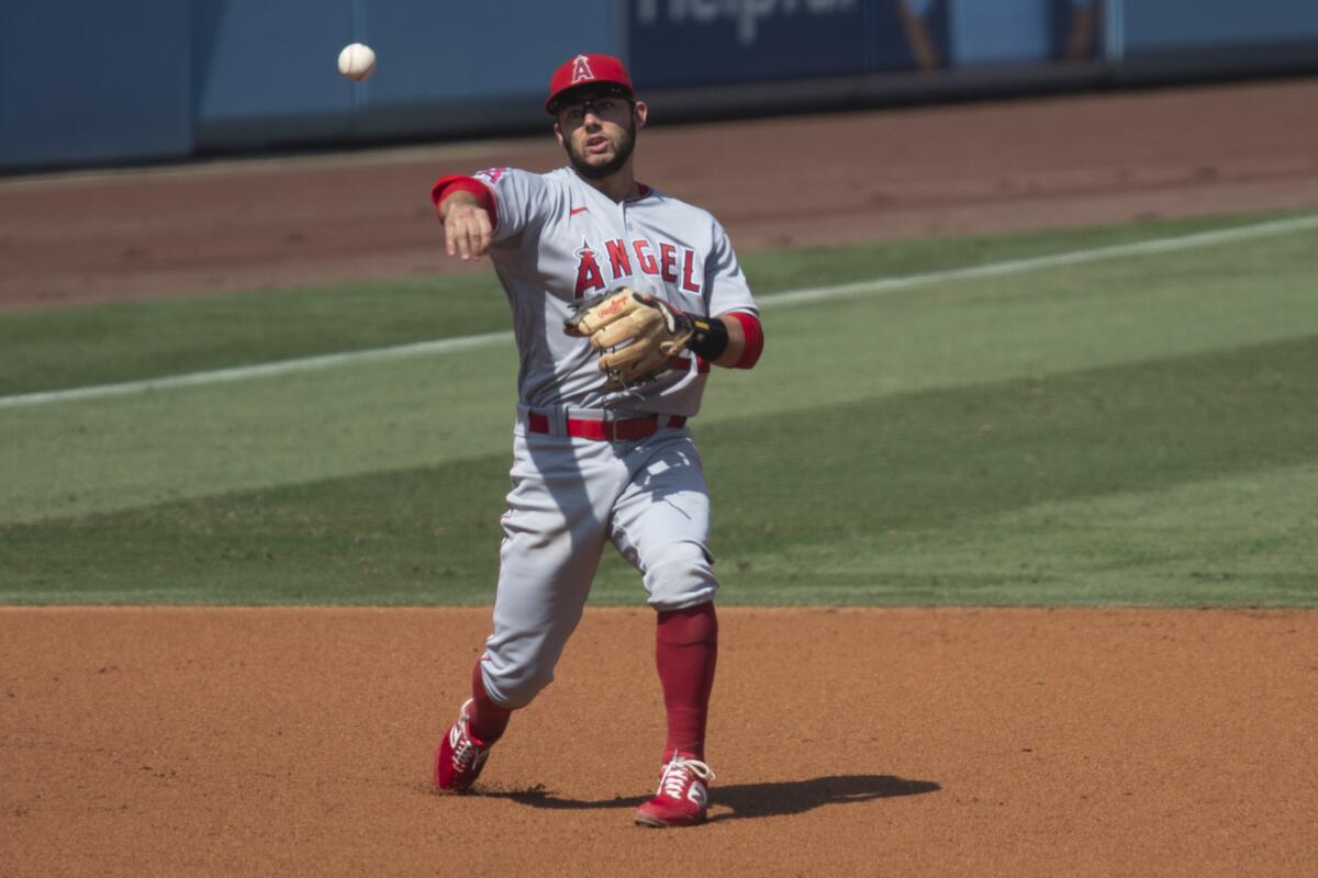 Angels third baseman David Fletcher throws during a game against the Dodgers on Sept. 27.