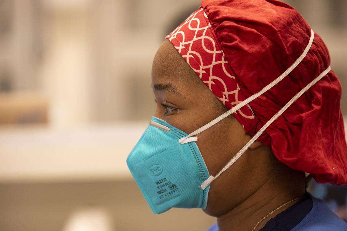 A nurse wears an N95 mask.