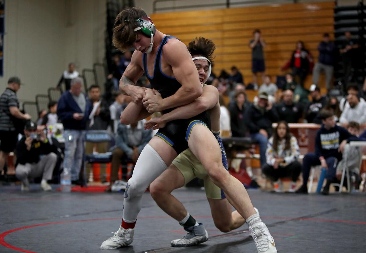 Fountain Valley's Zach Parker competes against Calvary Chapel's Koa Ruiz during the 145-pound final of the Mann Classic.