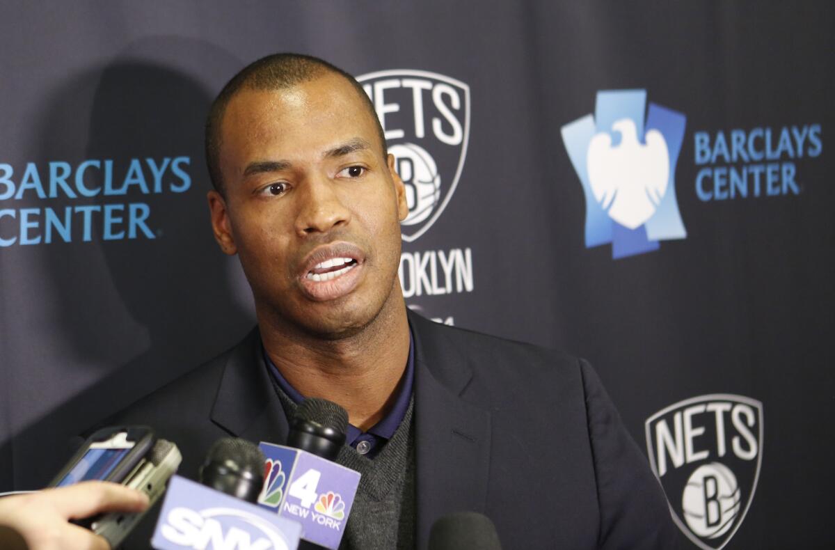 Jason Collins speaks to reporters in November 2014.