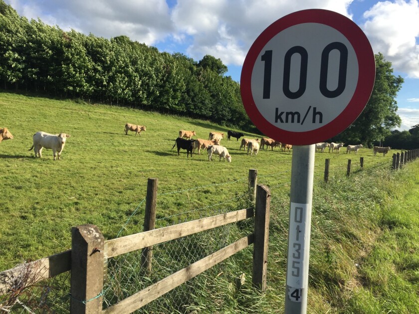 A speed limit sign in kilometers denotes the European Union side of the Ireland-Northern Ireland border.