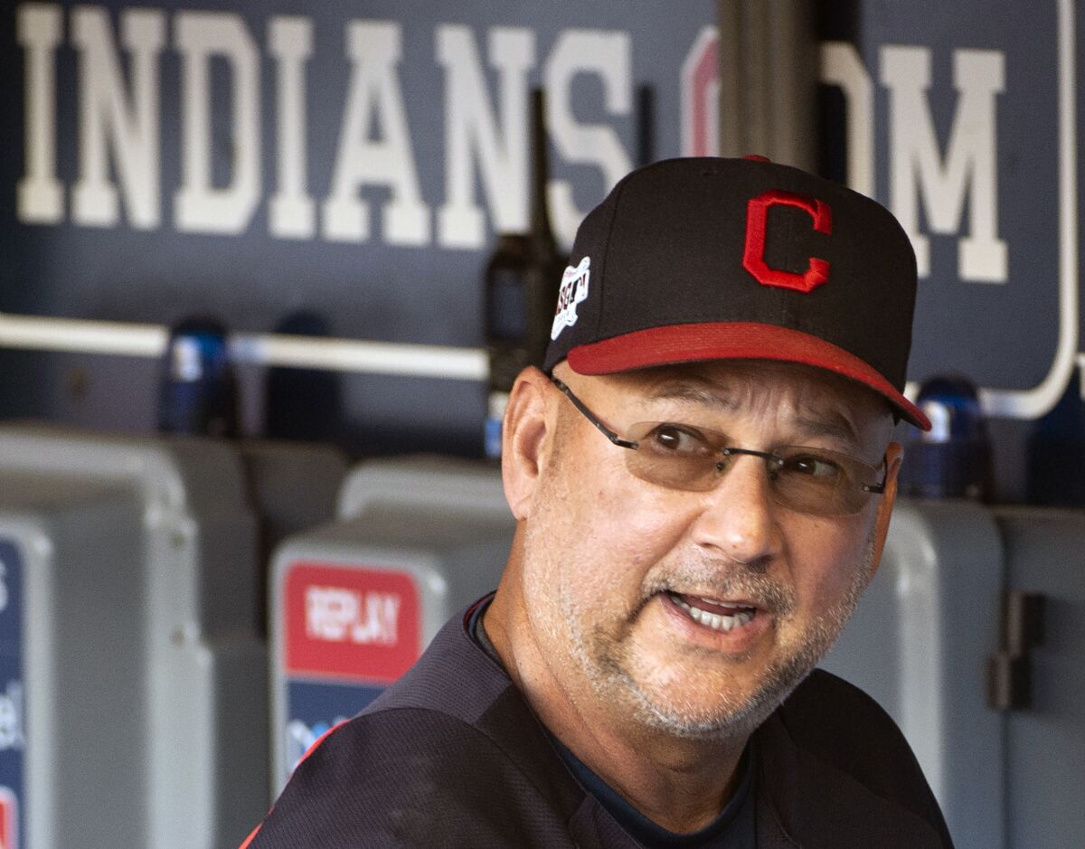 FILE - This is a Sunday, Sept. 22, 2019, file photo showing Cleveland Indians manager Terry Francona talking before a baseball game against the Philadelphia Phillies in Cleveland. Baseball is back, but because of the coronavirus, official scorers will work remotely this season to rule on hits and errors, make other judgments and tabulate box scores. Francona said the game slows down as you get farther away from the action, which affects judgment on deciding whether a play should be a hit or an error. So he's not keen on scorers working from home.(AP Photo/Phil Long, File)