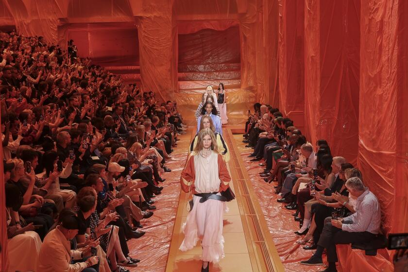Models wear creations for the Louis Vuitton Spring/Summer 2024 womenswear fashion collection presented Monday, Oct. 2, 2023 in Paris. (AP Photo/Vianney Le Caer)