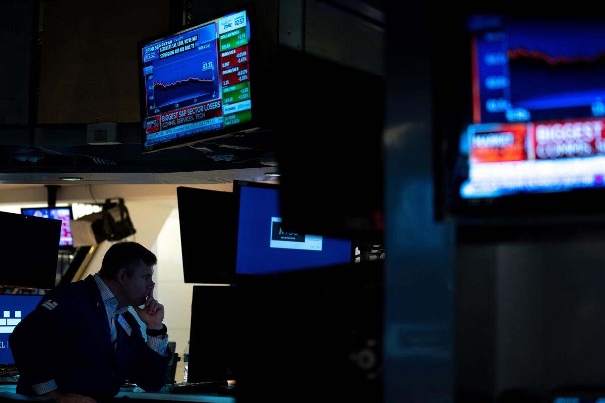 A trader works on the floor of the New York Stock Exchange. 