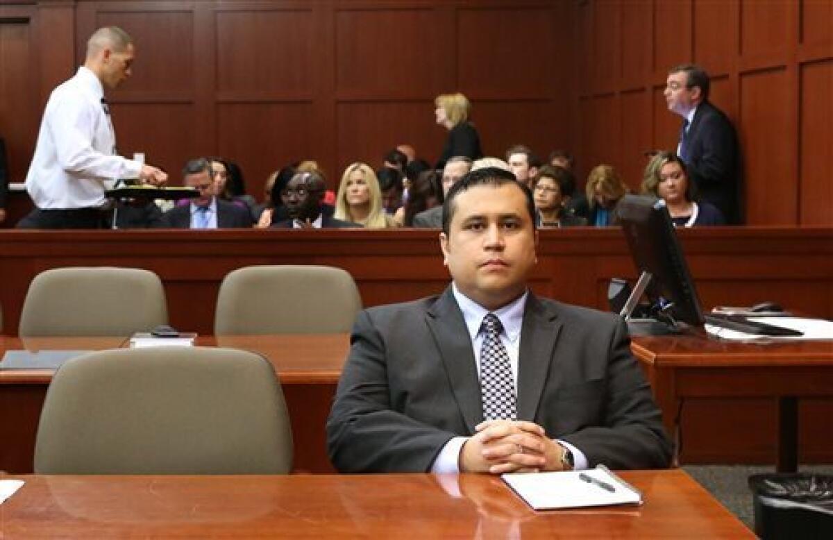 George Zimmerman waits for his defense counsel to arrive in court for his second-degreemurder trial, in Sanford, Fla.