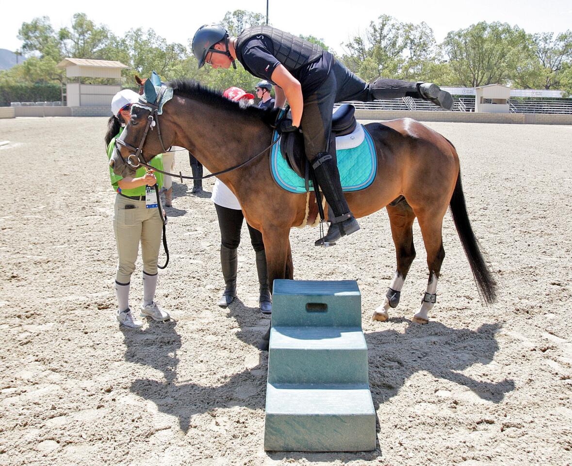 Swiss Special Olympics equestrian athlete Sandro Wessneo mounts Super Mario, a horse he and his coach will evaluate at the Los Angeles Equestrian Center on Monday, July 27, 2015. Four teams, A through D, matched horses with riders for all of the riders from all of the countries participating in the equestrian events at the Special Olympics.