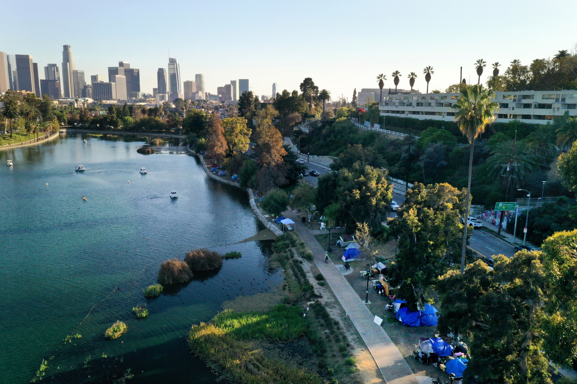 Aerial view of Echo Park Lake with blue tarps and tents visible