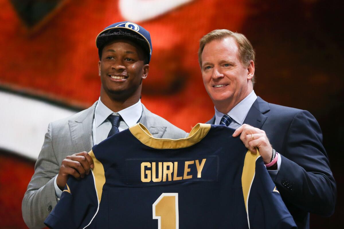 Todd Gurley holds up a jersey with NFL Commissioner Roger Goodell after being picked No. 10 overall by the St. Louis Rams during the 2015 NFL draft in Chicago on April 30.