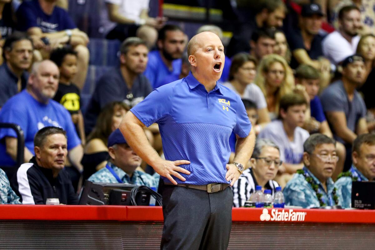 UCLA men's basketball coach Mick Cronin directs his players during a game against Chaminade in Hawaii on Nov. 26.