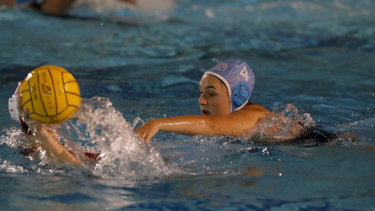 Corona del Mar High's Kaity Greenwald, left, defends against Orange Lutheran on Tuesday.