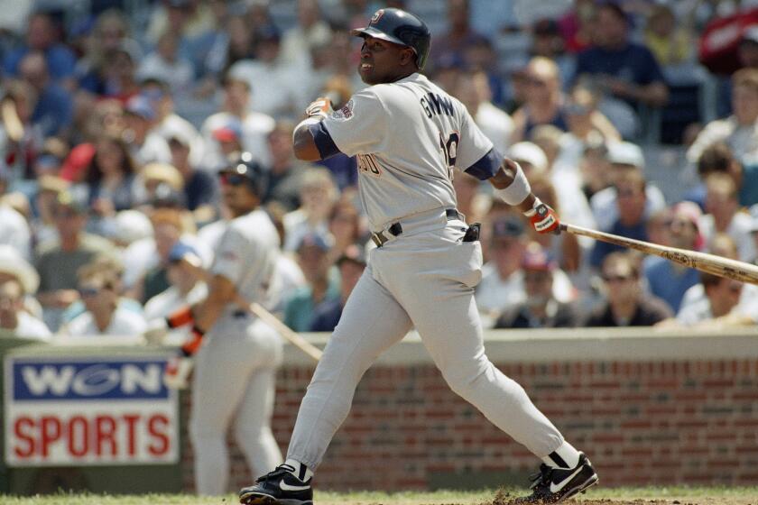 Tony Gwynn of the San Diego Padres eyes his RBI double in the first inning of the Padres 5-1 win over the Chicago Cubs, Sunday, August 7, 1994 in Chicago. Gwinn, baseballs leading hitter, went 3-for-5 on Sunday. (AP Photo/Frank Polich)