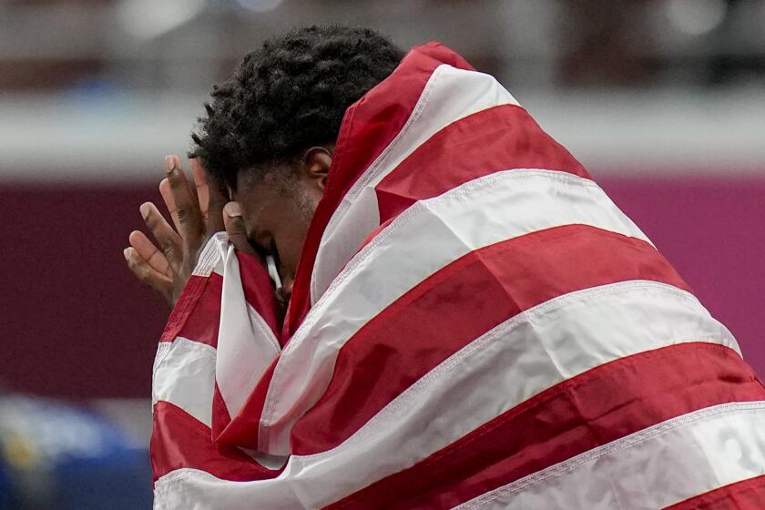 Bronze medalist Noah Lyles, of the United States, reacts after the men's 200-meter final at the 2020 Summer Olympics, Wednesday, Aug. 4, 2021, in Tokyo. (AP Photo/Petr David Josek)